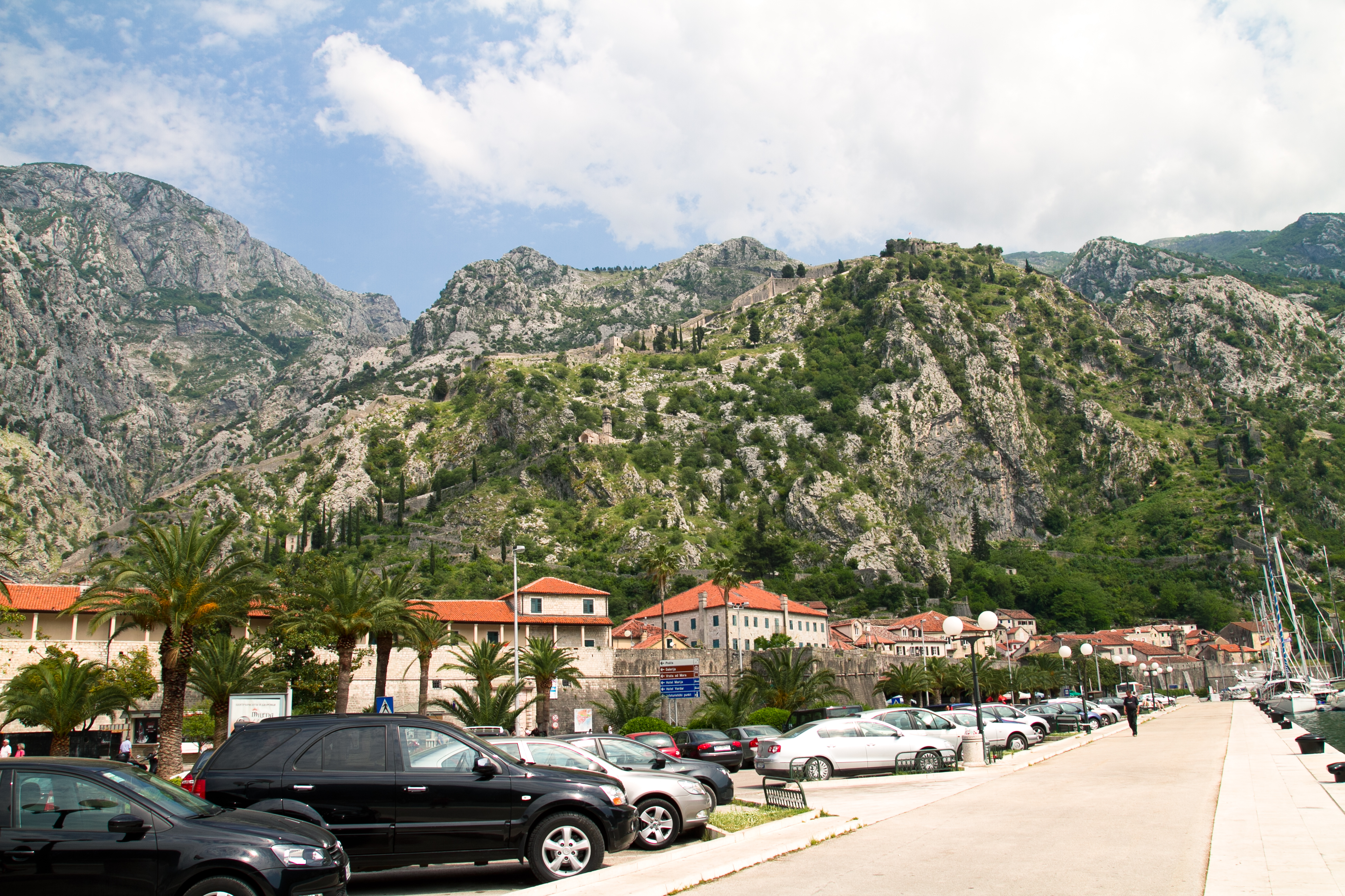 Cruise ship entering the Bay of Kotor with medieval town and mountains